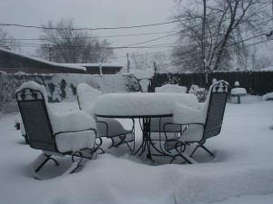 outdoor furniture covered in snow